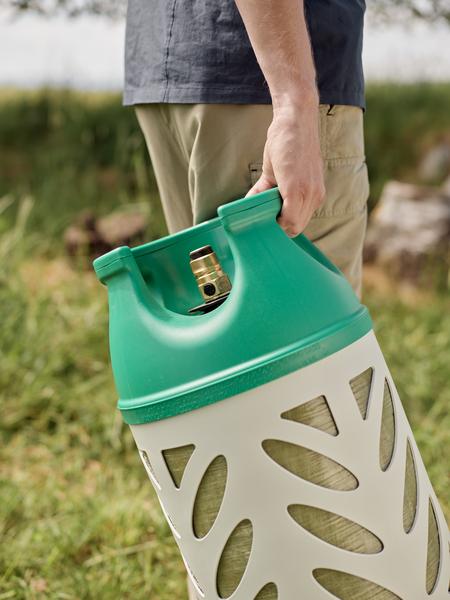 Man carrying composite propane cylinder