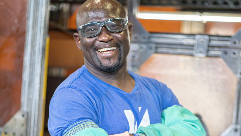 Worthington Worker smiling with goggles on