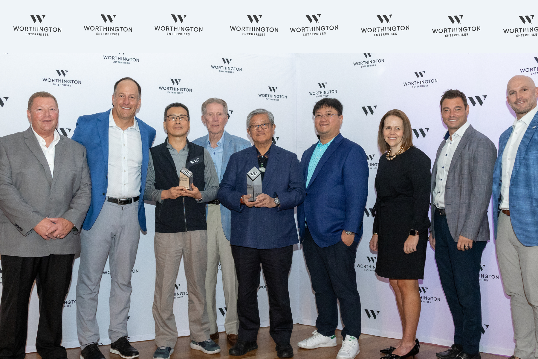 Group posing with award